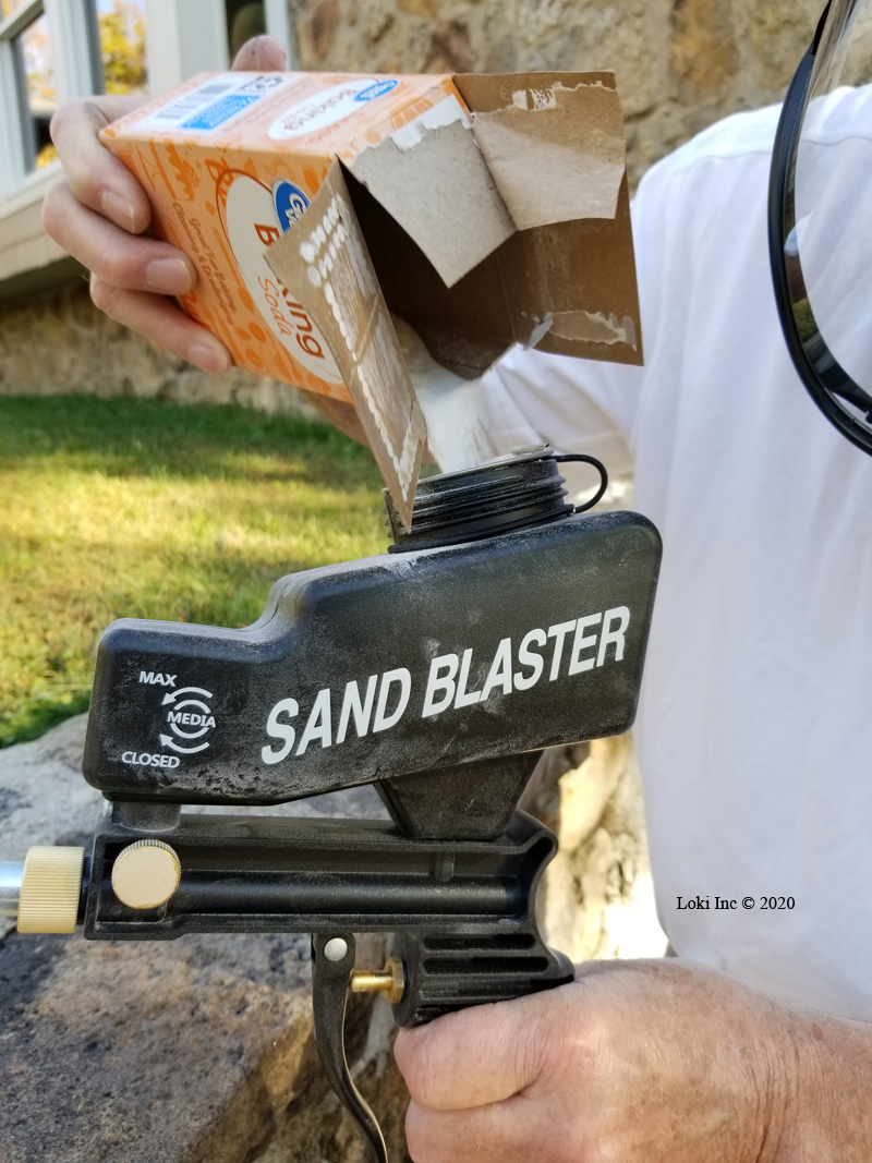 Loading soda into the blast gun - even plain baking soda worked!